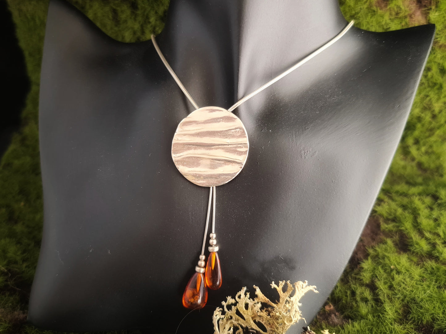 Textured sterling silver handmade pendant with amber beads