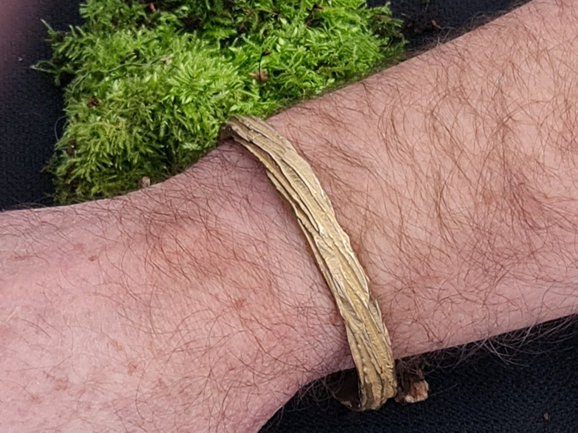 Beech wood bronze bangle modelled on male arm
