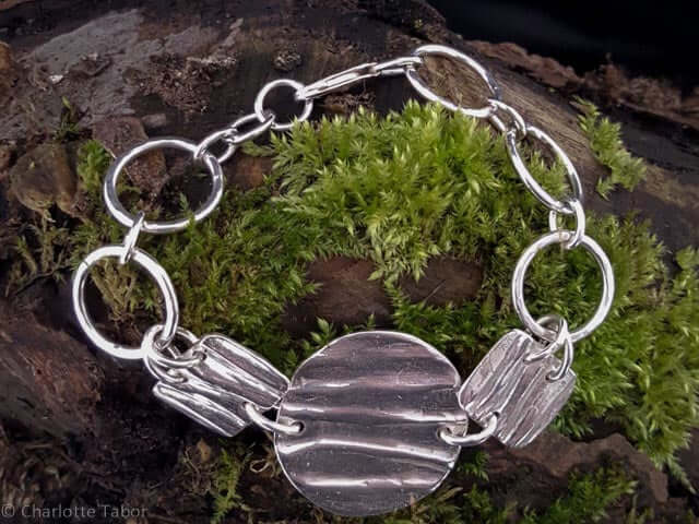 Amsbury wood silver bracelet with a tree bark texture