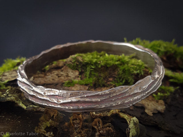 Beech wood oxidised silver bangle with tree bark texture